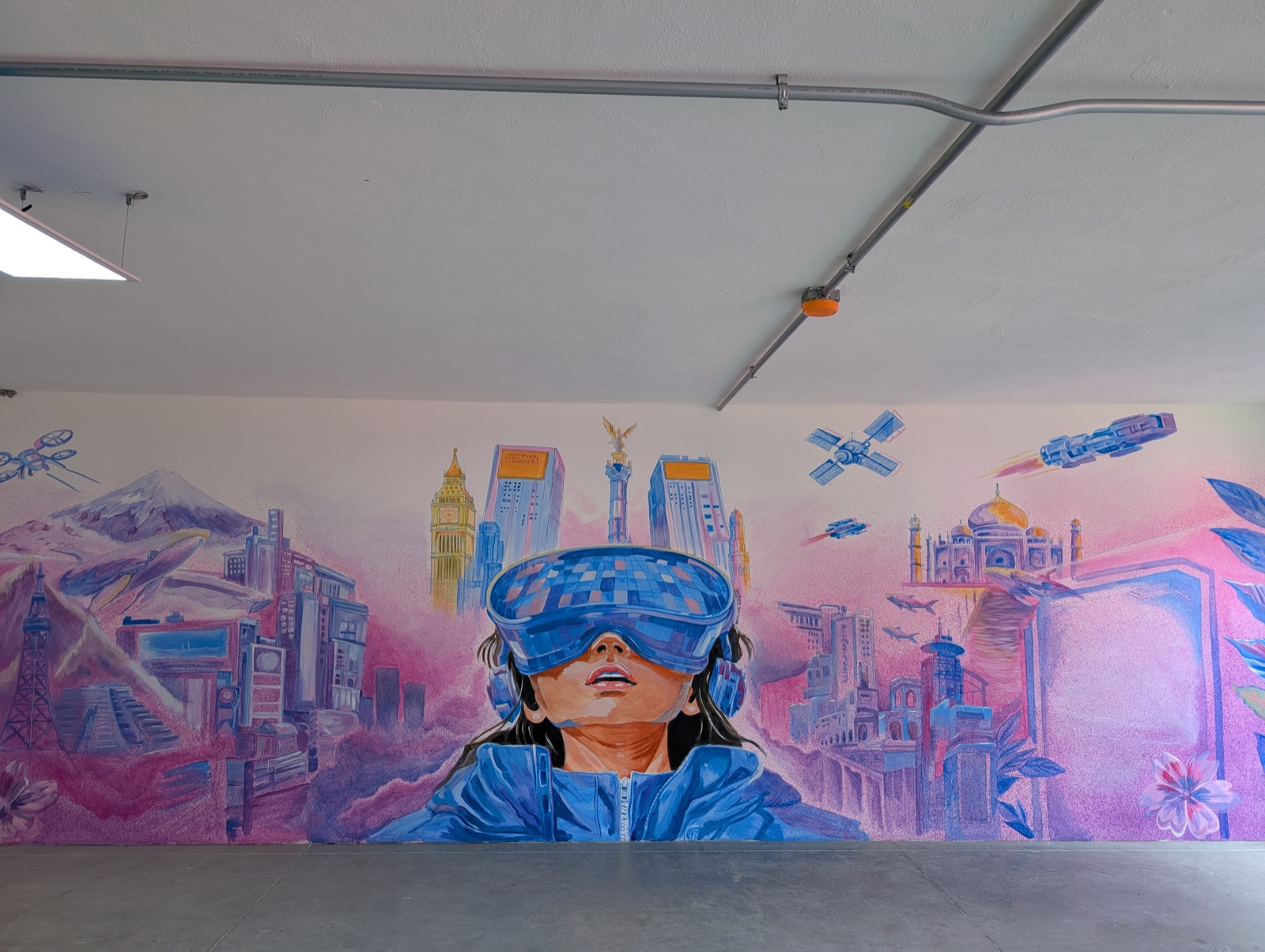 Mural of a girl wearing a virtual reality headset in the space that will host virtual reality activities